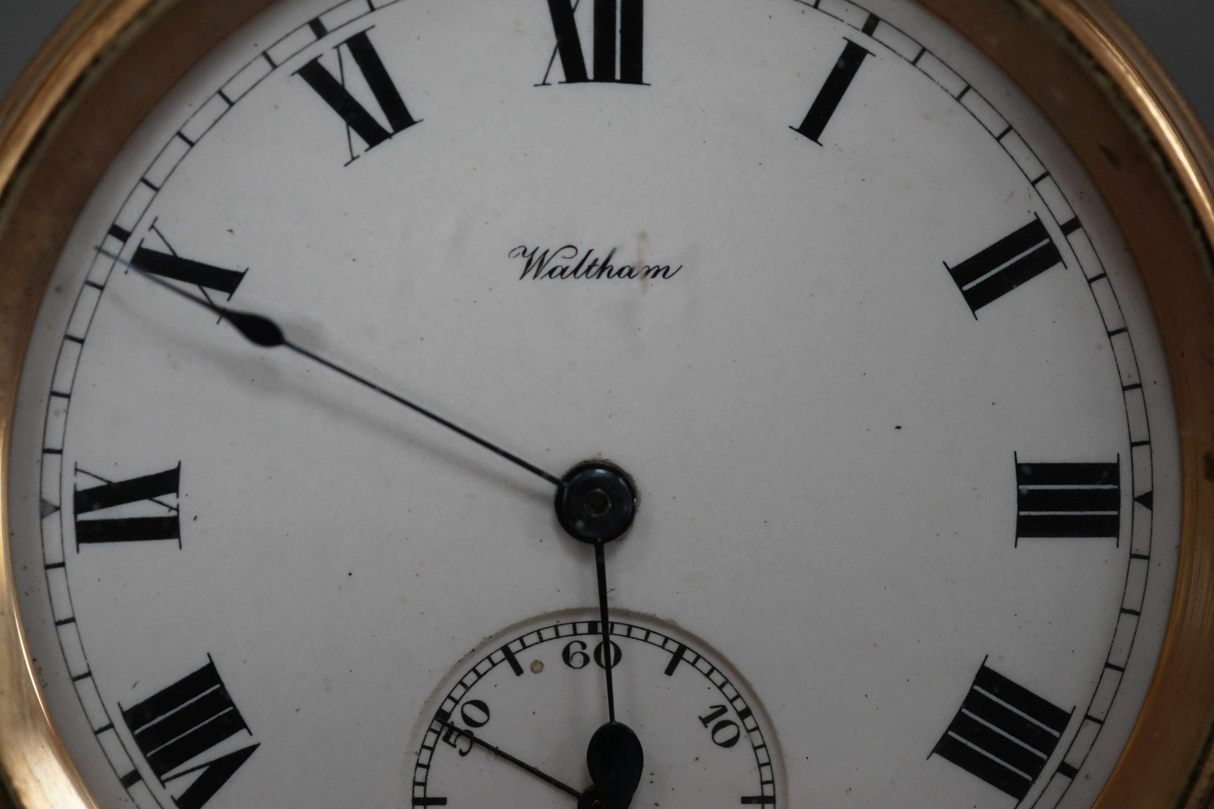 A 9ct gold Waltham keyless pocket watch, with enamelled Roman dial and subsidiary seconds, movement number 20221272, gross 122 grams.